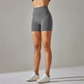 Close-up of grey high-waisted yoga shorts with seamless tummy control and elastic fabric - Dark Gray