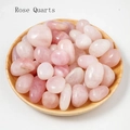 Polished natural rose quartz crystals presented in a minimalist round wooden tray - 100g/Pack / Rose Quartz