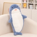 Cute gray-blue shark plush pillow toy on a beige sofa in a cozy home setting - Shark / 70cm