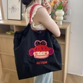 Bolso tote de nailon negro con bordado de dibujos y asas trenzadas de color rojo - Mono de Boca Grande Negro