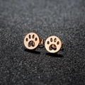 Polished stainless steel round stud earrings featuring a hollow paw print design in rose gold - 438 Rose Gold (Paw Print)