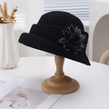 Elegant black knit cloche hat with a large satin flower and sparkling rhinestone details - Black