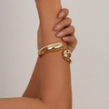 Polished golden irregular open cuff bracelet with a minimalist sculptural design - Asymmetric Sculptural Gold Cuff (SL242) / Gold