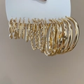 Detailed view of assorted golden geometric hoop earrings with various textures and sizes - Eco-friendly Gold (16Pairs/Set) (Silver Pin)