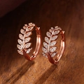 Exquisite rose gold olive leaf hoop earrings with micro-set zircons on wooden background - Rose Gold