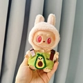 Labubu doll in rabbit hood and green avocado knit overalls displayed in hand - Avocado Overalls Two-piece Set / First And Second Generation Keychains Are Compatible With La Cloth Dolls. Dolls Not Included.