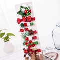 Christmas hair clips set for girls featuring festive stars and red bows on a card - 10-Piece Green Sequin Star Set