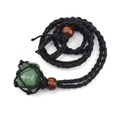 Detail of green raw stone pendant in a black hand-woven mesh bag with wooden beads - Green Aventurine