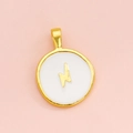 Macro detail of round white enamel pendant with a gold lightning bolt and metal rim - White Lightning
