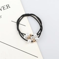 Three-strand black elastic hair tie with white pearls and gold bead accents - Black
