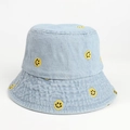 Close-up of yellow smiley face embroidery and texture on light blue denim bucket hat - M (56-58cm) / Light Blue