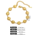 Golden titanium steel geometric bracelet with twisted spiral discs and adjustable chain - Spiral Twist (Round Pattern)