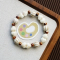 Handmade ceramic bracelet with off-white shell beads and reddish-brown accent beads - Ruyi Lock Style (1645-06) / Off White