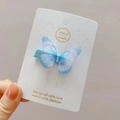 Detail of a blue and purple gradient tulle butterfly hair clip with rhinestones for girls - Blue