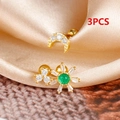 Macro shot of 3pcs gold ear studs set with moon and sun designs and green zircon - Gold (E1548)