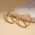 Macro detail of 18K gold plated irregular oval earrings with brushed matte texture - Gold