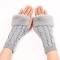Close-up of grey cable knit fingerless gloves with soft faux fur trim for winter warmth - One Size / Light Gray