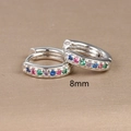 Detail shot of 8mm silver hoop earrings featuring multi-color gemstones on gold background - 8mm / Silver