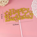 Golden glitter Happy Birthday cake topper with star details, 12.8cm width on pink background - Star HB Gold