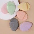 Set of 6 colorful oval facial sponges with porous texture on white circular platform - Teardrop / Pink