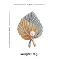 Elegant gold and silver leaf brooch with pearl detail and dimensions 2.8cm by 3.9cm - Two-Tone Leaf