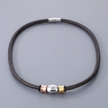 Brown braided leather bracelet with tri-color metal rings and a magnetic clasp closure - Style A Necklace (KN282874-TXH)