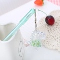 Cute light green semi-transparent pen with a sparkly green dinosaur charm and chain - Dinosaur Green