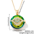 Vintage evil eye necklace in gold with green crystal and blue pavé detail charms - Emerald Green/N00921-161