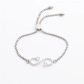Silver infinity charm bracelet with sparkling cubic zirconia and adjustable slider clasp - Steel Color