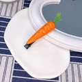 Cute carrot-shaped hair clip with orange resin fruit design and black alligator grip - Carrot