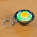 Realistic Japanese ramen bowl keychain featuring fried egg and green onions on wood - Egg Noodles with Keychain / 5cm x 2cm x 2.5cm