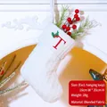 White knitted Christmas stocking with red embroidered letter T and holly decor, 16x20cm - Letter T / White