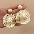 Handmade raffia hoop earrings with woven floral details and bohemian straw hat design - Silver Earring Post-White