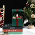 Détail de la boîte à musique de Noël avec bonhomme de neige et mini sapin décoré - Boîte à musique bonhomme de neige verte