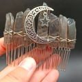 Close-up of handmade natural crystal hair comb with metallic star and moon details - Smoky Quartz