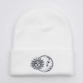 Close-up detail of sun and moon embroidery on a white knitted beanie hat fold - Adult(54-60cm) / White