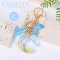 Ocean beach style letter C keychain with sand, seashells, blue fish tail and tassel - Letter C
