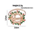 Christmas wreath napkin ring with green leaves and gold reindeer for festive tables - Reindeer Wreath