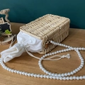 Handwoven rattan bag with white canvas drawstring pouch and large pearl chain strap - Rectangle