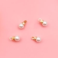 Set of four cream white round pearl pendants with golden metal caps and bail rings - 4mm KC Gold Round