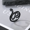 Detailed view of a matte black gothic snake ring on a minimalist stone display - Adjustable Open / Smooth Snake 1
