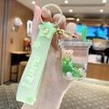 Porte-clés ours en peluche vert dans une tasse de thé au lait avec liquide mouvant - Ours Sable Mouvant - Tasse De Thé Au Lait / Vert