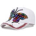 Macro detail of white baseball cap with colorful rhinestone butterfly and studded brim - Adjustable / White