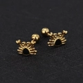 Detailed close-up of golden crab earrings with black enamel inlay and screw ball backs - Crab / Gold