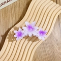 Lila Haarspange mit drei Frangipani-Blüten im Farbverlauf für Damen aus Harz - Dreifache siebenstrahlige Blüten / Lila