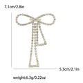 Sparkling crystal bow brooch in gold metal plating with size details 7.1cm by 5.3cm - Gold