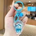 Blue astronaut liquid quicksand keychain with acrylic charm and glitter sequins - Small Quicksand Astronaut - Blue