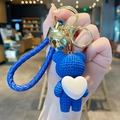 Blue resin bear keychain with knitted texture holding a white heart and matching wrist strap - Resin Heart Bear-Blue