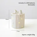 Ceramic gift box night light with gold bow and star cutouts, size 7.7x9.6cm - Gift Box