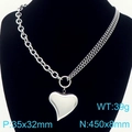 Silver stainless steel mixed link chain necklace with a hollow heart pendant on a model - Heart Pendant Necklace / Silver